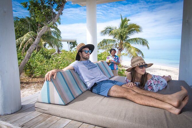 Malamala Beach Club - Full Day - The infinity pool, beach chairs, and island rhythm